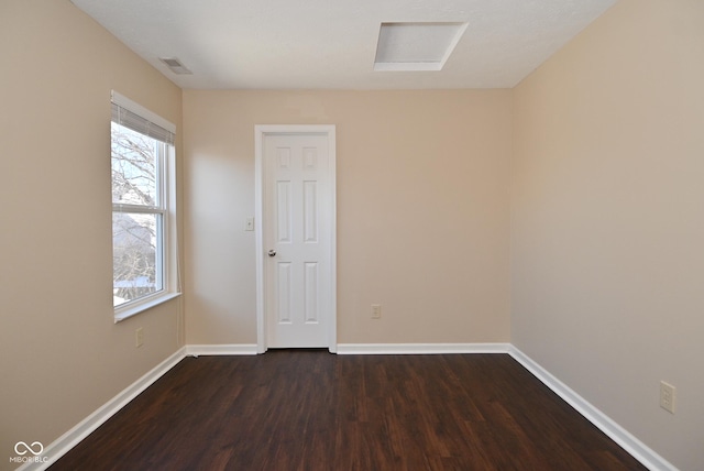 empty room featuring dark wood-type flooring