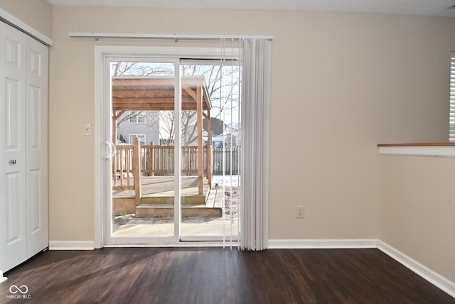 doorway to outside featuring dark hardwood / wood-style floors