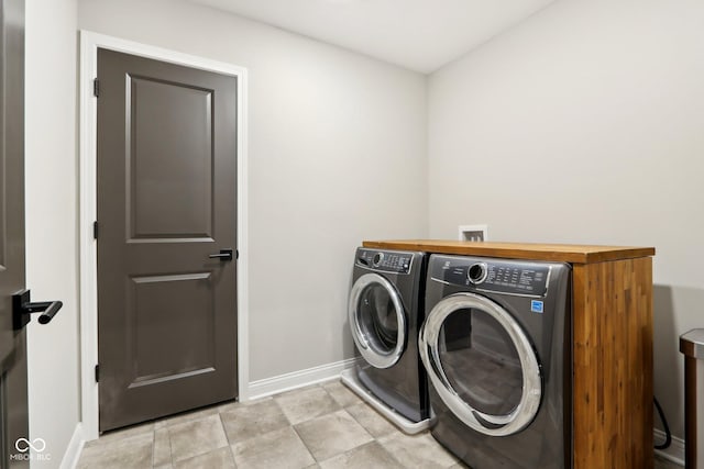 laundry room with separate washer and dryer