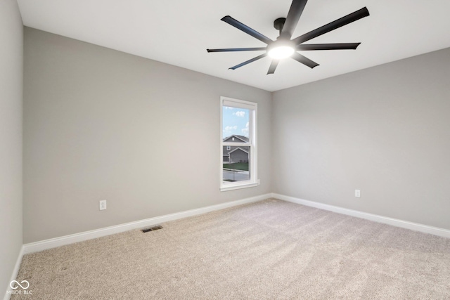 carpeted empty room with ceiling fan