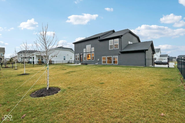 back of house featuring a yard