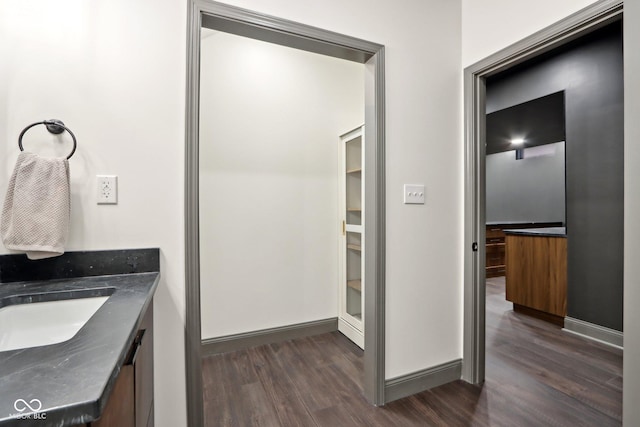 bathroom with vanity and hardwood / wood-style flooring