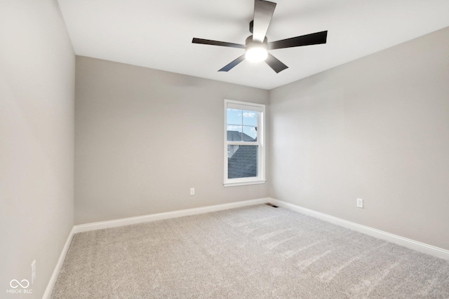 unfurnished room featuring carpet and ceiling fan