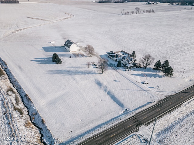 birds eye view of property with a rural view