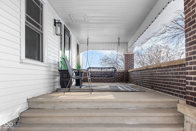 wooden deck featuring covered porch