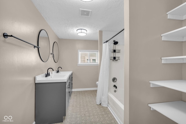 bathroom featuring visible vents, shower / bath combo with shower curtain, a textured ceiling, vanity, and baseboards