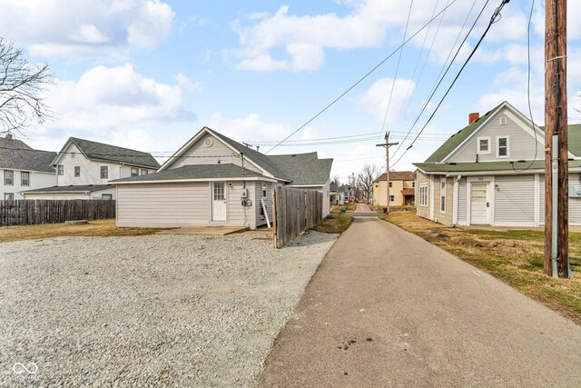 view of front of house with fence and a residential view