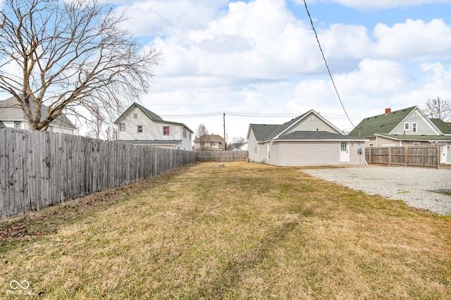 view of yard with a fenced backyard