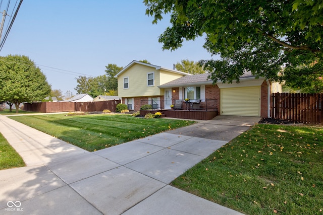 tri-level home with a front lawn