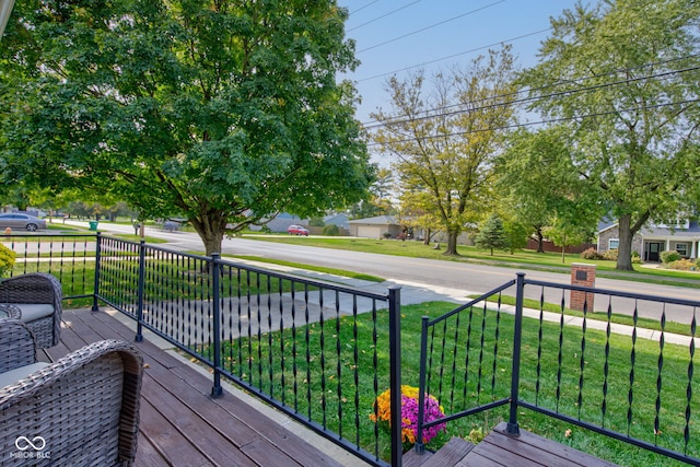 wooden deck with a yard