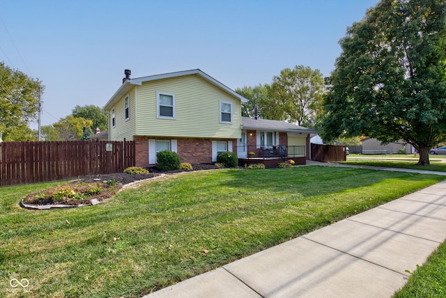 split level home with a front yard