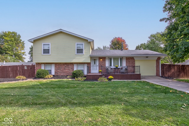 tri-level home with a front lawn