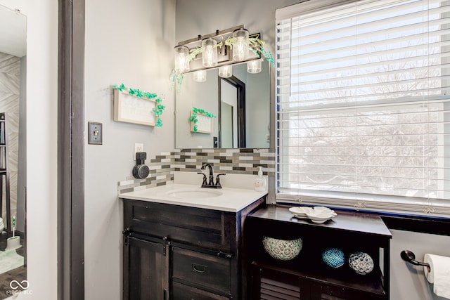 bathroom featuring decorative backsplash and vanity