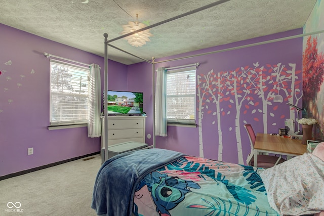 bedroom with carpet floors and multiple windows