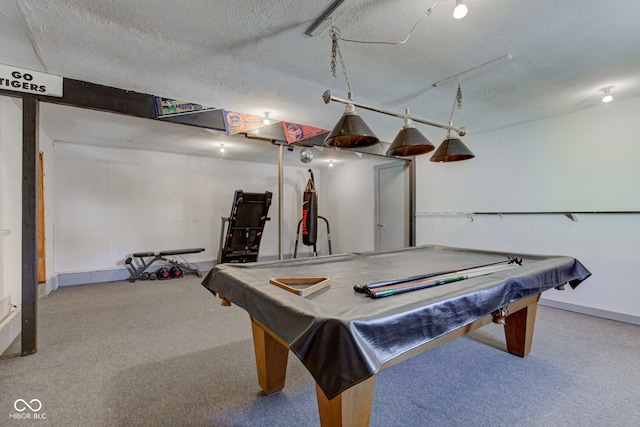 recreation room with a textured ceiling and pool table