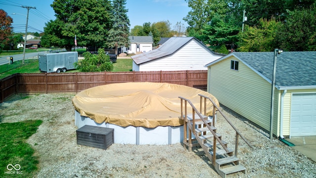 view of yard with a covered pool