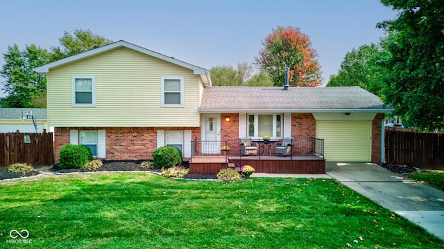 split level home featuring a front lawn