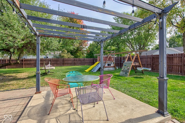 view of patio with a pergola and a playground