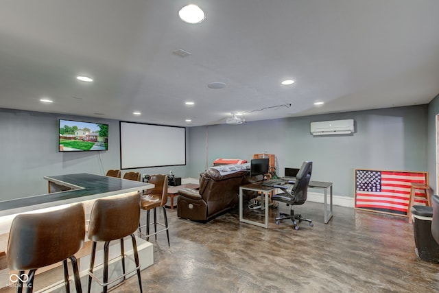 cinema room with a wall unit AC and concrete floors