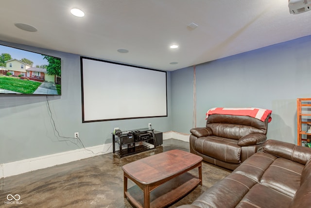 home theater featuring concrete flooring