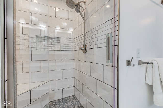 bathroom with a shower with shower door