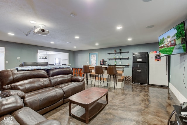 living room with concrete flooring