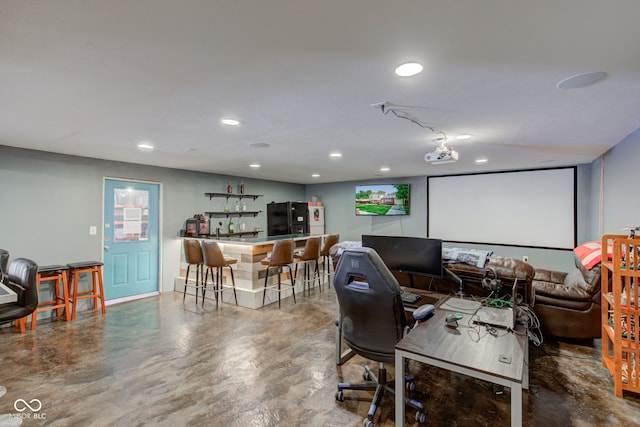 home theater room with concrete floors