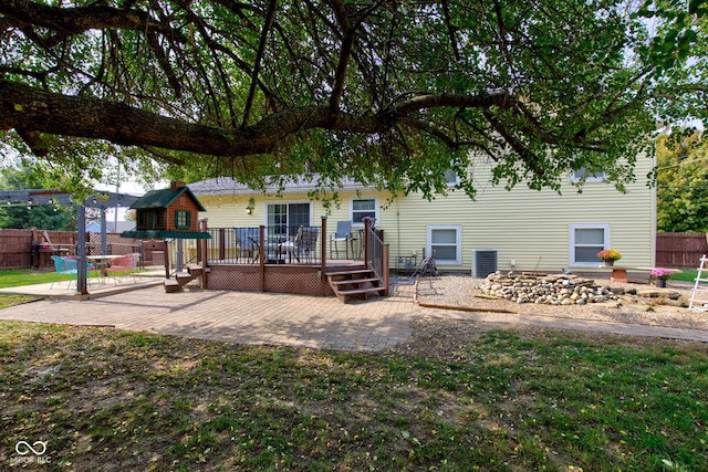 rear view of house featuring a patio area, central AC, and a deck