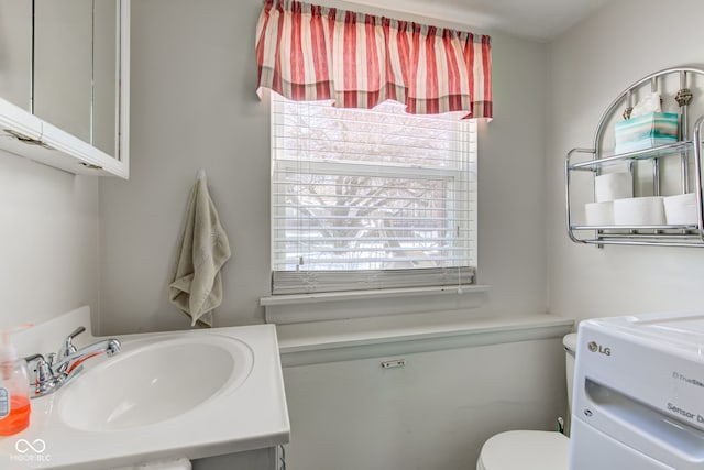 bathroom with toilet and sink