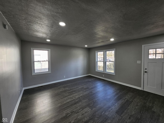 foyer featuring plenty of natural light and a textured ceiling