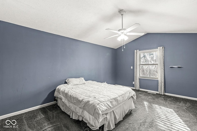 bedroom featuring a textured ceiling, ceiling fan, lofted ceiling, and dark colored carpet