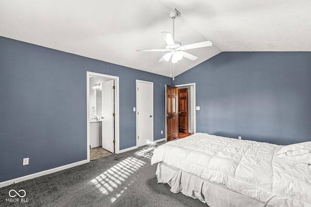 bedroom with carpet, vaulted ceiling, ensuite bath, and ceiling fan