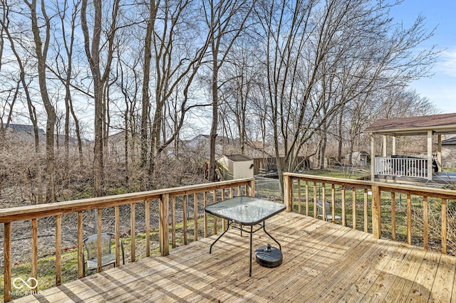 wooden deck with a shed