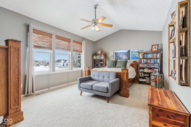 carpeted bedroom featuring ceiling fan and vaulted ceiling