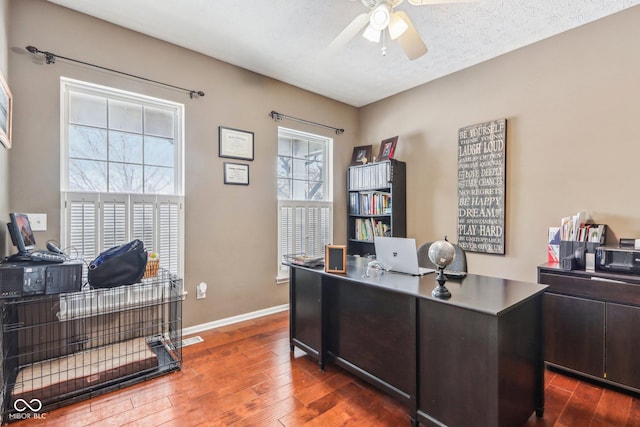 office featuring ceiling fan, dark hardwood / wood-style floors, and a textured ceiling