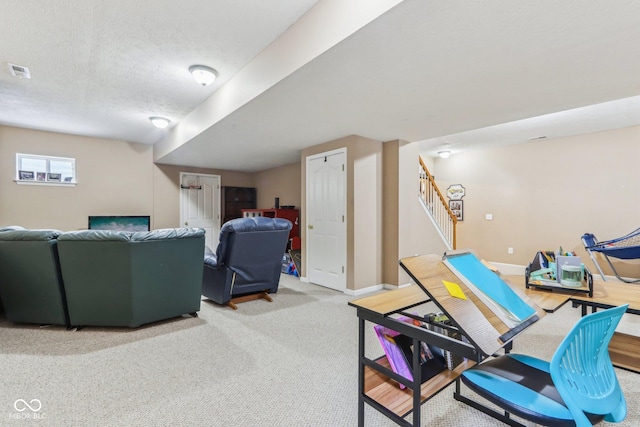 carpeted living room featuring a textured ceiling