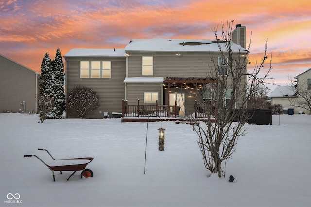 view of snow covered house