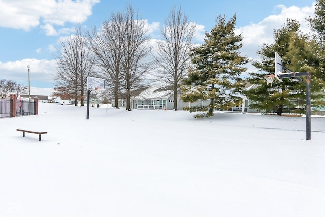 view of yard layered in snow