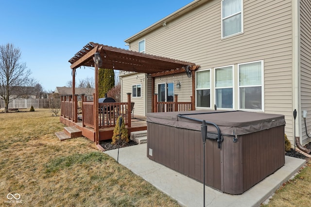 exterior space featuring a hot tub, a yard, a deck, and a pergola