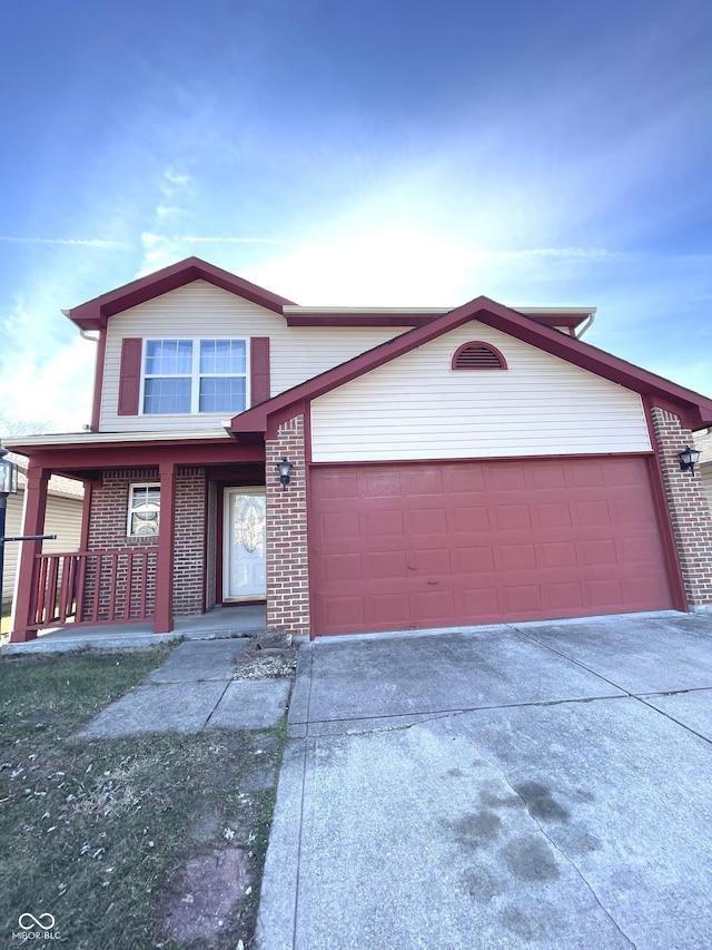 view of front of home featuring covered porch and a garage