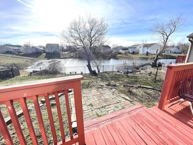 wooden deck with a patio area and a water view