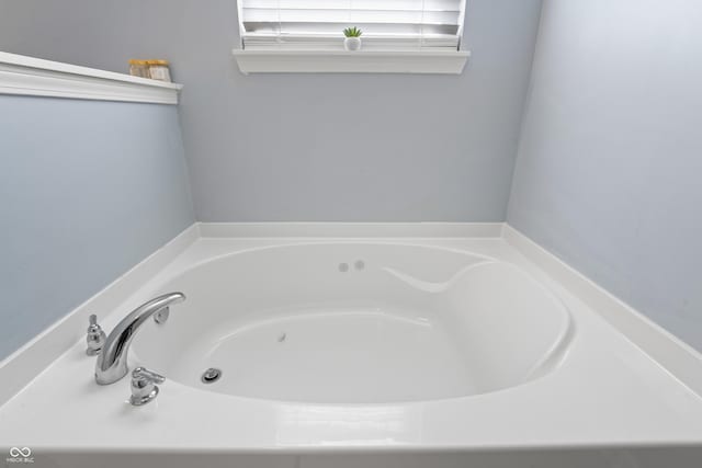 bathroom featuring a tub to relax in