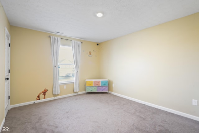 interior space featuring a textured ceiling and carpet floors