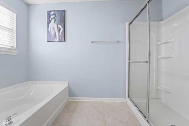 bathroom featuring tile patterned flooring and plus walk in shower