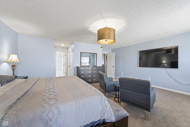 carpeted bedroom featuring a textured ceiling