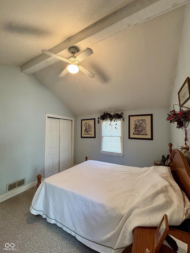 carpeted bedroom with lofted ceiling with beams, ceiling fan, visible vents, baseboards, and a closet