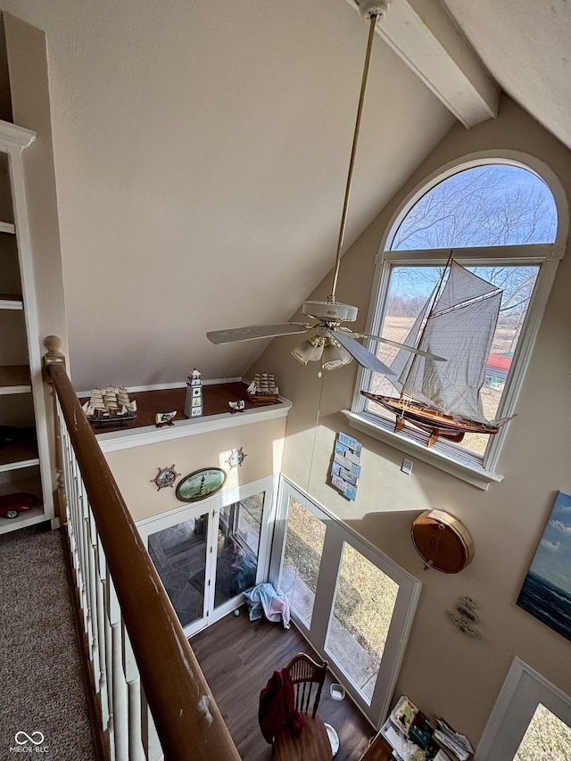 room details featuring ceiling fan, beam ceiling, and wood finished floors