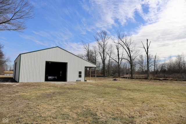 view of yard with a garage, an outbuilding, and an outdoor structure