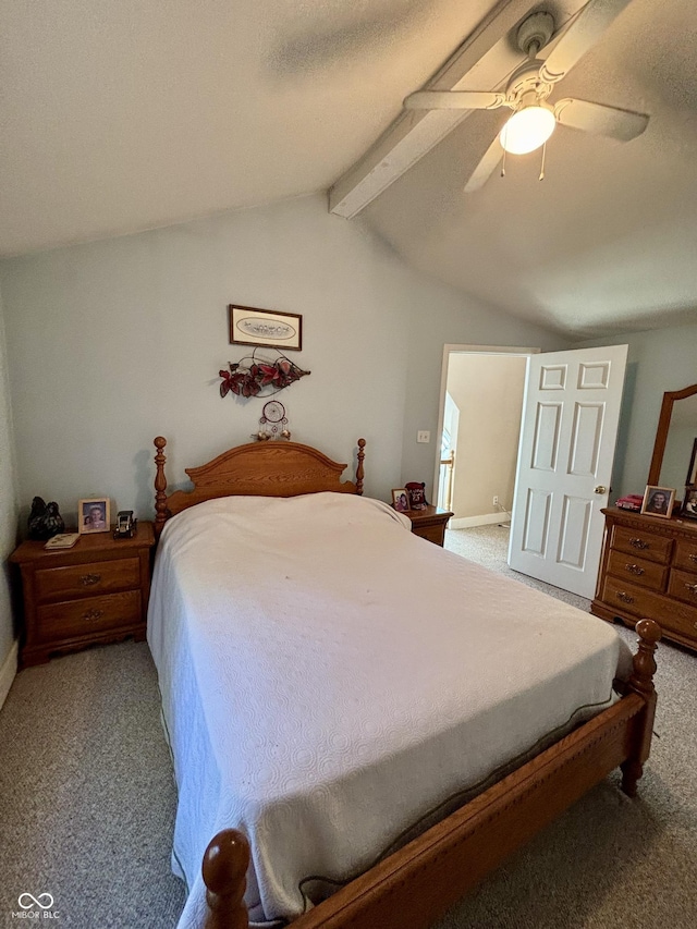 bedroom with a ceiling fan, carpet flooring, and vaulted ceiling with beams