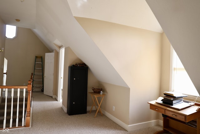 additional living space with carpet, vaulted ceiling, and baseboards